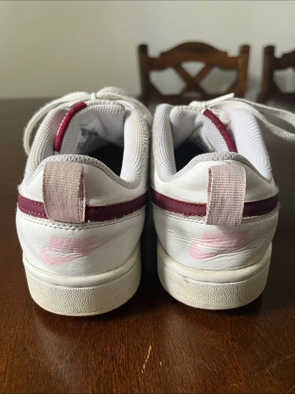 Nike Kids White Sneakers with Maroon Swoosh and Light Pink Details